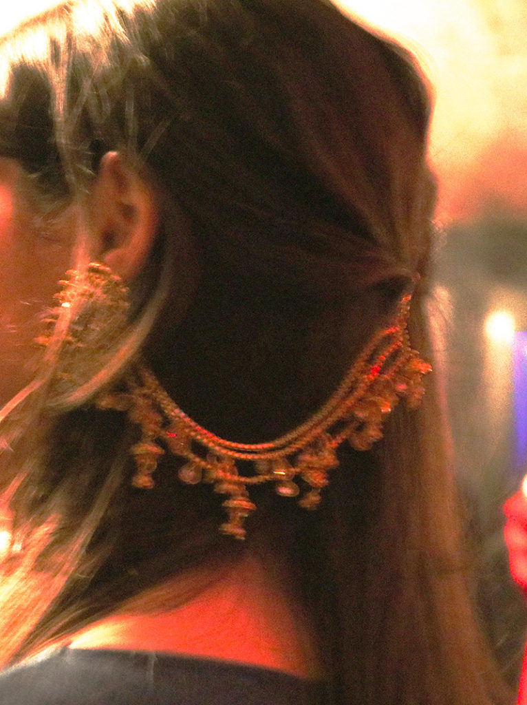 Artist AZURE wearing an Indian-inspired headpiece.