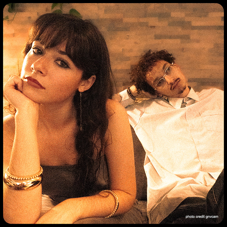 AZURE singer and Noa Emien producer sitting on a couch.